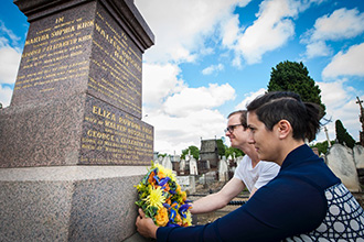Students lay wreath of flowers at Eliza Hall's grave