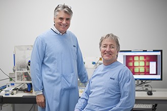 Professor Phil Hogkin and Dr John Markham in a lab